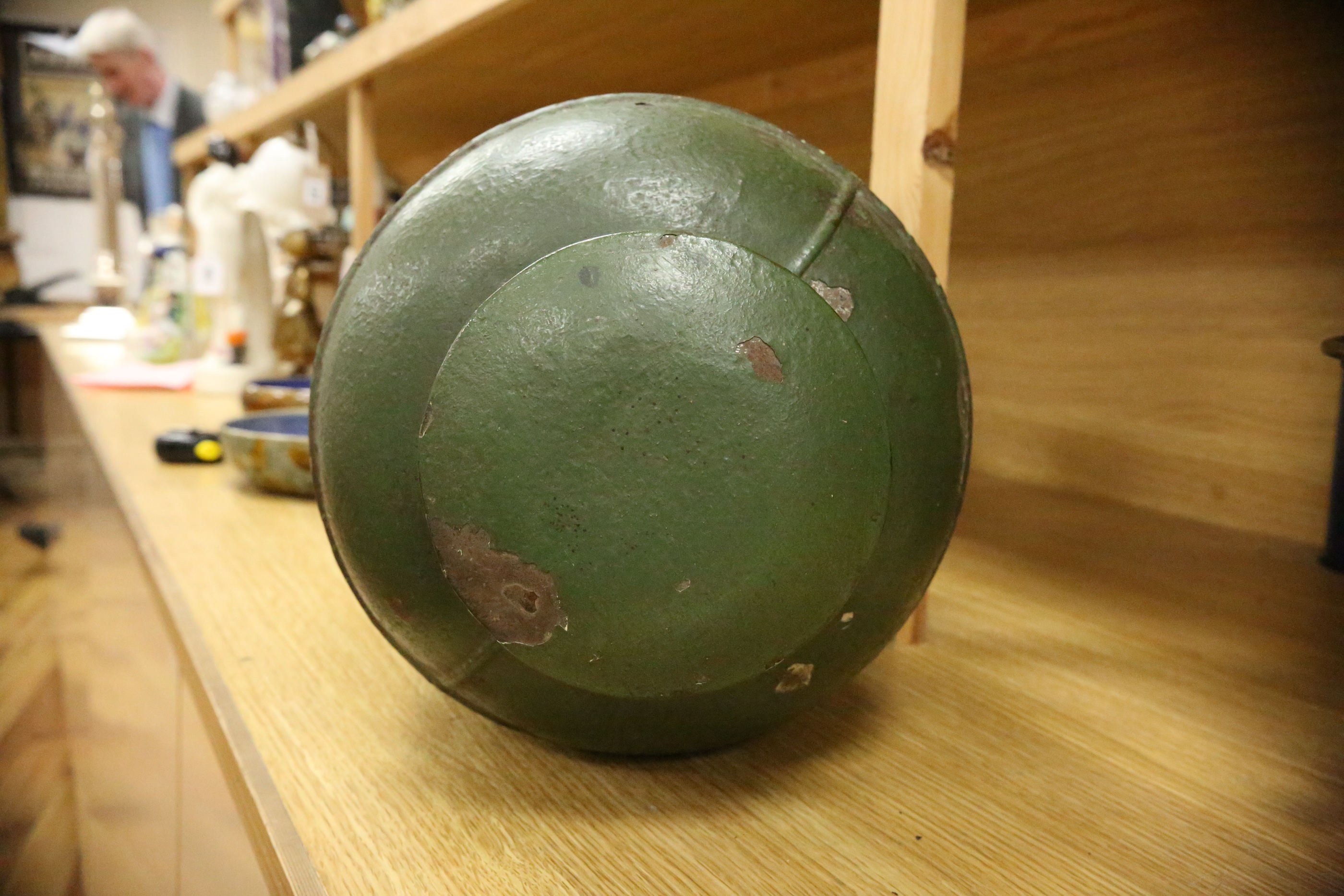 A green toleware floral decorated tea canister, 42cm high. Condition - poor, many chips to surface paint